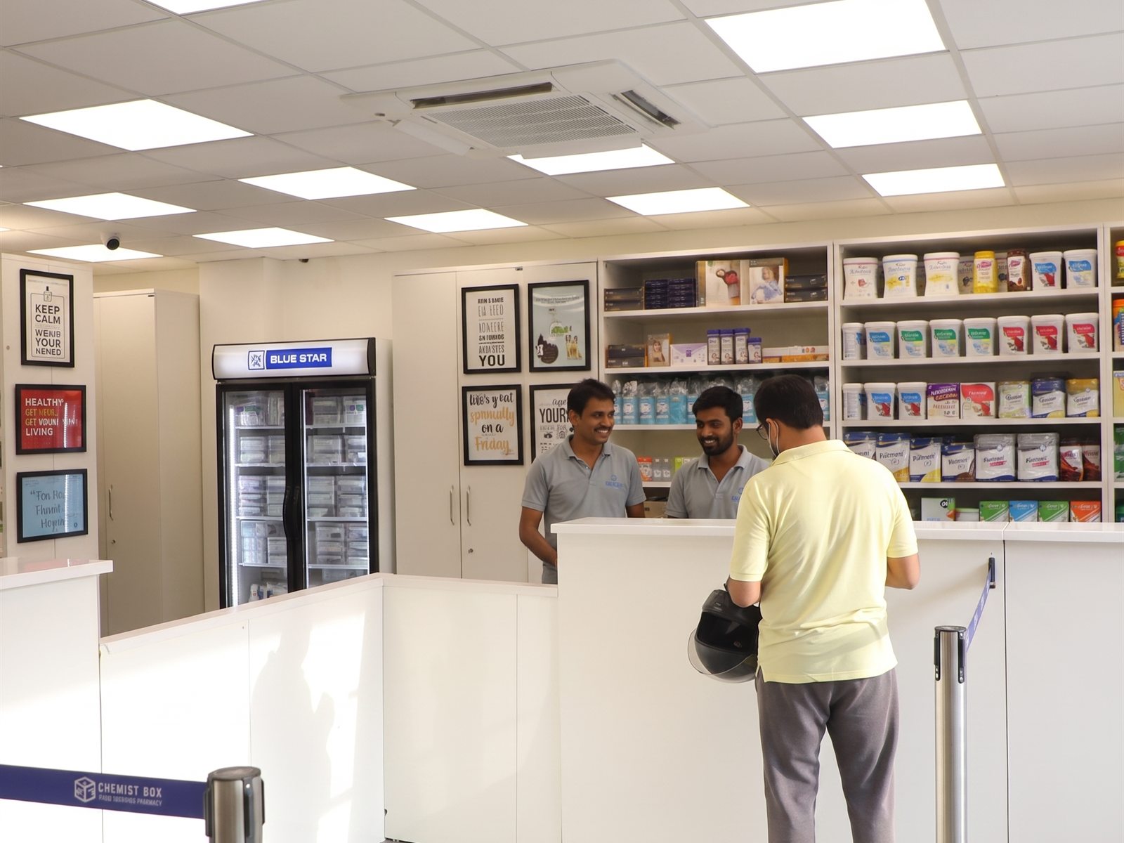 Customers queuing at the Chemist Box billing counter, rated 4.5+ on Google